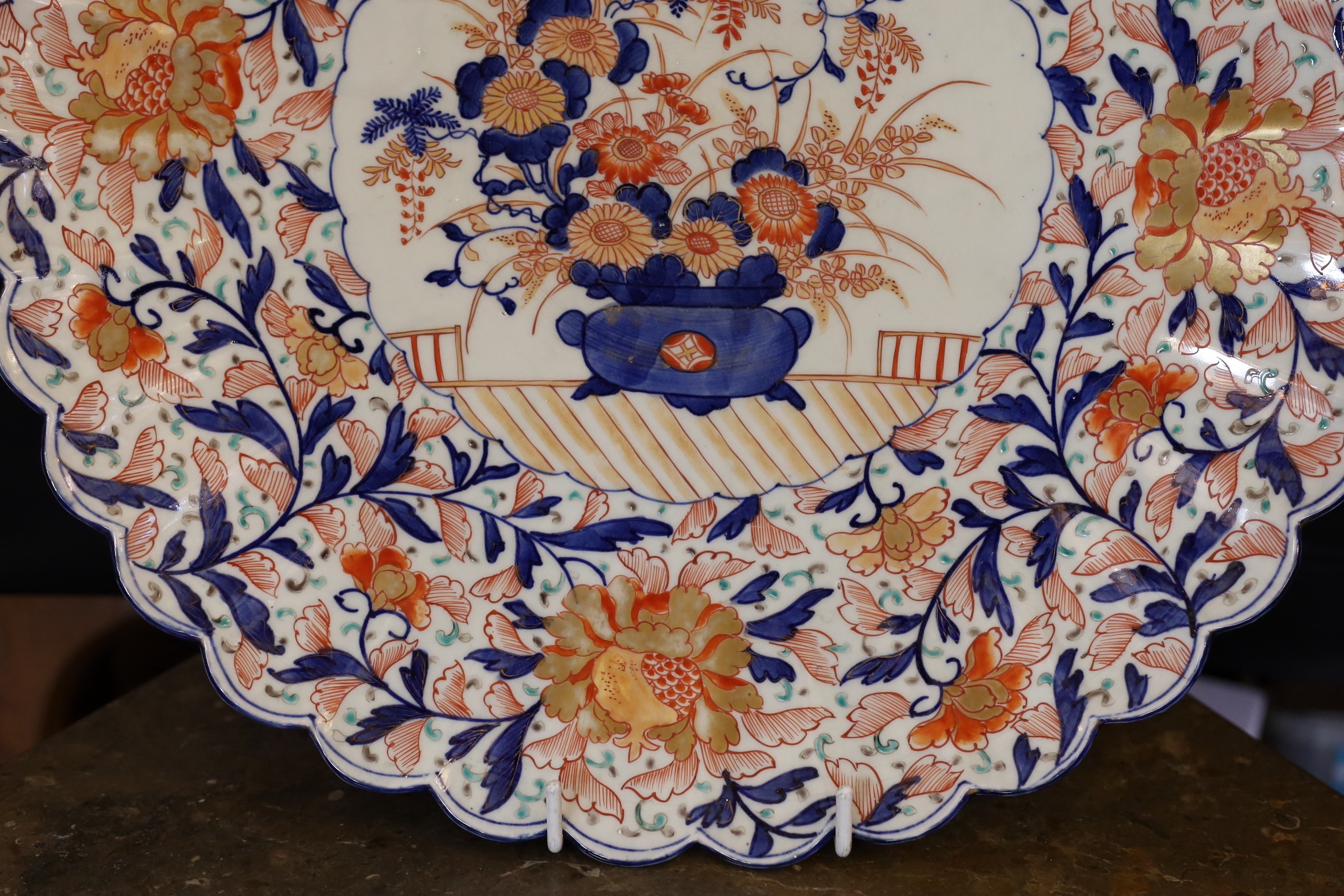 An Imari charger decorated with a central panel of flowers in a vase within floral borders, diameter 47 cm